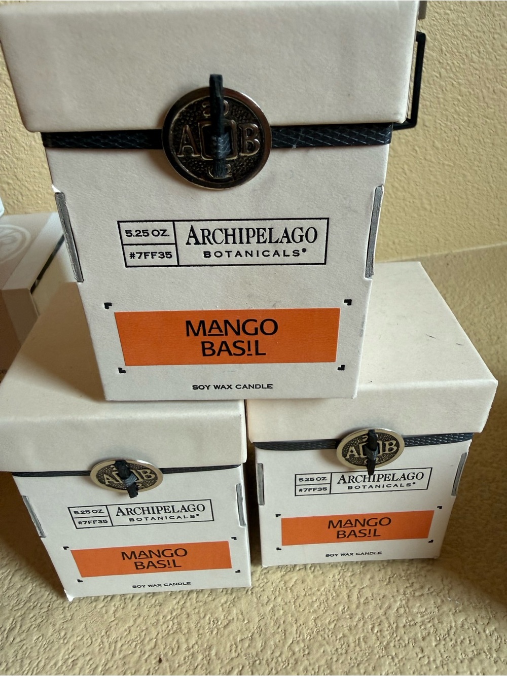 Archipelago Mango Basil Candles - White and Orange Boxes $20 per